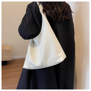 Close-up of white pebble grain texture and large capacity of this casual shoulder tote bag