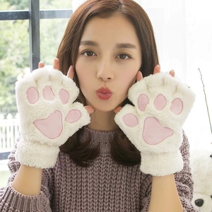 Detail of plush cat paw fingerless gloves featuring pink heart-shaped soft padding