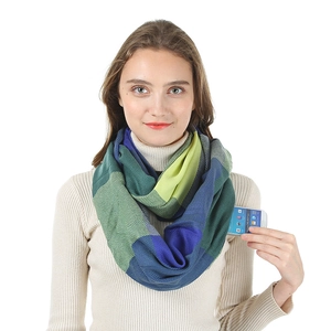 Macro view of checkered infinity scarf with a hidden zipper pocket for phone storage