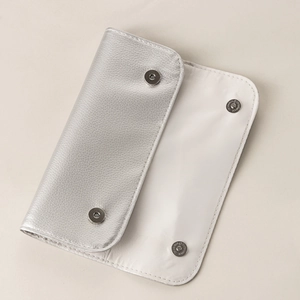 Silver pebble grain leather makeup brush holder bag with metallic snap buttons