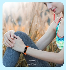 Outdoor sports tracker featuring orange silicone strap and black LED digital display