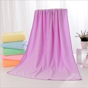 Microfiber bath towel with bear embossing in multiple colors like purple and yellow