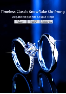 Macro shot of classic six-prong moissanite couple rings on a dark blue background
