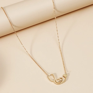 Minimalist gold stethoscope necklace with heart heartbeat pendant for women