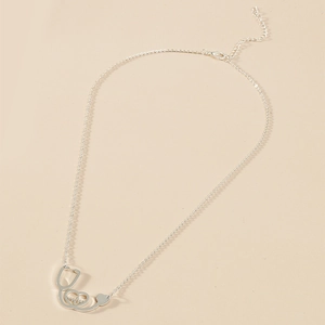 Macro shot of silver stethoscope heart pendant with heartbeat line and lobster clasp