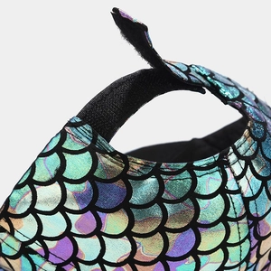 Detail of mermaid fish scale texture and adjustable Velcro strap on the baseball cap