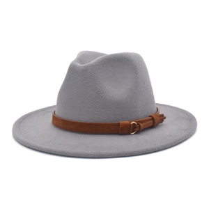 Close-up of grey felt fedora hat featuring a brown suede band and golden buckle detail