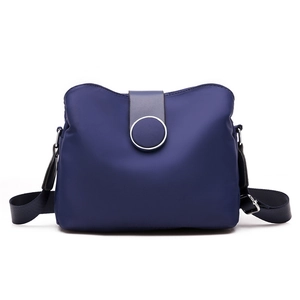 Blue nylon crossbody bag for women with adjustable shoulder strap and metal buckle detail