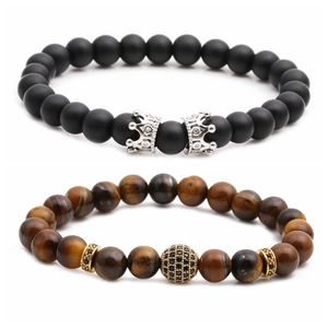 Tiger eye and matte black beaded bracelet set with silver crowns and golden cz ball