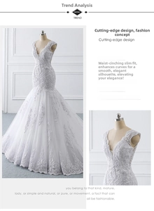 Detail of mermaid wedding dress with deep V-neck, lace appliques, and shimmering sequins