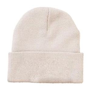 Close-up of fine knit texture and soft fabric on a warm beige acrylic winter beanie