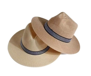 Detailed view of two stacked beige straw hats with black and white woven bands