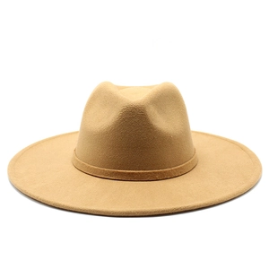 Detail view of the camel wool fedora hat showing its wide brim and elegant teardrop crown