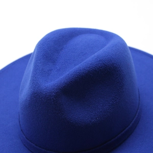 Detail view of the high-quality dark blue wool felt fabric on a wide-brimmed jazz fedora hat