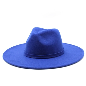 Detail of bright blue wool felt fedora hat with wide brim and elegant ribbon band