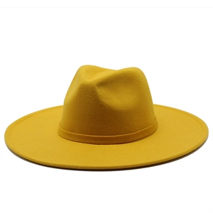 Detailed view of the bright yellow fedora hat showing textured felt fabric and matching band
