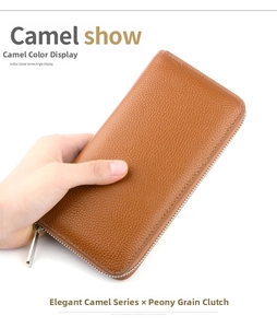 Detailed view of camel leather wallet with lychee texture and silver zipper closure