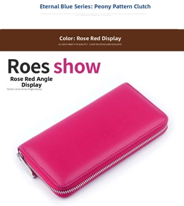 Detail of rose red pebbled leather wallet with silver metal zipper closure