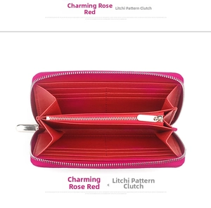 Detail view of rose red leather wallet interior with lychee grain texture and card slots