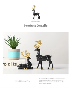 Detailed view of geometric black resin deer statues with golden antlers for home decor
