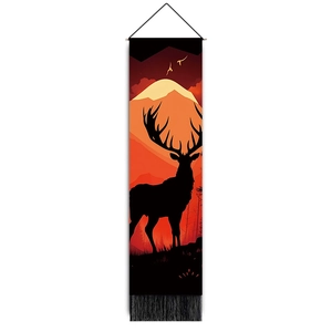 Detailed view of forest deer silhouette tapestry featuring mountain peaks and orange tassels