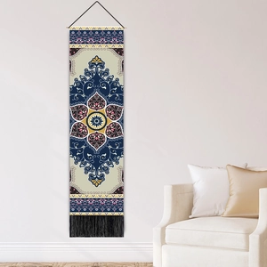 Ethnic style wall hanging with skull sword print and black tassels in living room