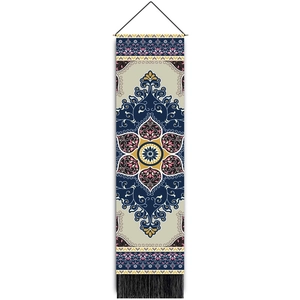 Close-up of woven tapestry featuring symmetrical geometric patterns and black bottom tassels
