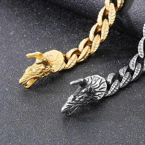 Detailed close-up of punk dragon head clasps in gold and vintage silver finish