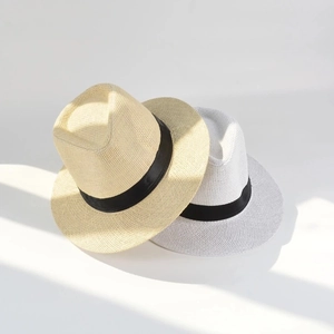 Classic straw fedora hats in beige and white with black ribbon bands for sun protection