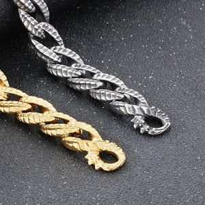 Macro detail of punk dragon scale chain bracelet with antique finish dragon head clasp