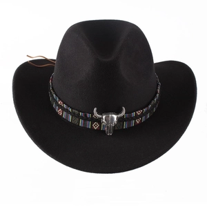 Classic black felt cowboy hat with ethnic woven band and silver bull skull ornament