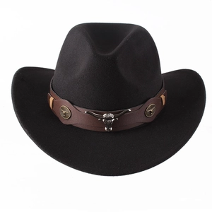 Detailed shot of black felt cowboy hat with leather band and metal bull head buckle