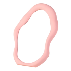 Pink irregular cloud-shaped vanity mirror with wavy plastic frame on white background