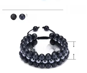 Macro view of 8mm lava and matte onyx stone beads with adjustable closure detail