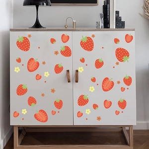 Fresh strawberry and flower wall decals on a white wooden minimalist storage cabinet