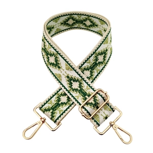 Detail of bohemian geometric jacquard bag strap with gold-plated metal swivel snap hooks