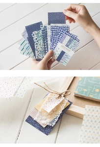 Detail of vintage style scrapbooking paper with blue patterns, stripes and floral designs