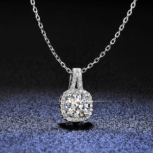 Macro shot of S925 silver halo pendant with round moissanite and shimmering small stones