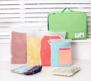 Detail of waterproof frosted travel storage bags with zippers for organizing clothing