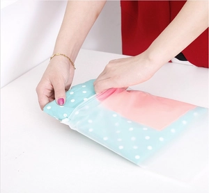 Close-up of translucent frosted waterproof zipper storage bags for clothing organization