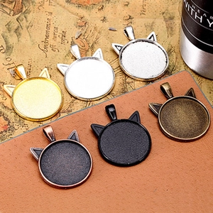 Detailed view of cat-ear pendant trays in six metallic finishes for DIY jewelry making