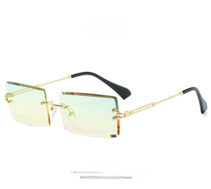 Detail of yellow gradient rimless sunglasses with gold metal temples and modern square lens