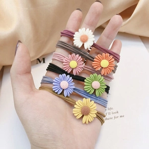 Close-up of colorful daisy flower hair ties with high elasticity and resin decorations
