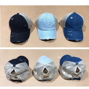 Rear view of distressed denim ponytail caps with mesh back and elastic criss-cross bands