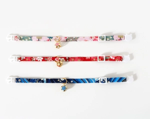Three-pack of adjustable floral pet collars with cute bells and cat-shaped safety buckles