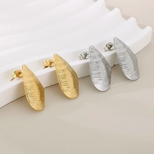 Minimalist irregular drop earrings with leaf texture in gold and silver finish