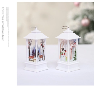 Detail of white Christmas lanterns with reindeer and snowman patterns in a cozy setting