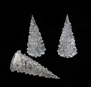 Close-up of three clear crystal Christmas tree ornaments with detailed leaf textures