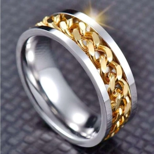 Macro shot of a spinning titanium steel ring with a chain inlay and metallic starburst glow