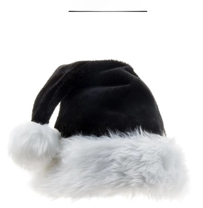 Detail showing plush black velvet texture and fluffy white faux fur pompom on Xmas hat